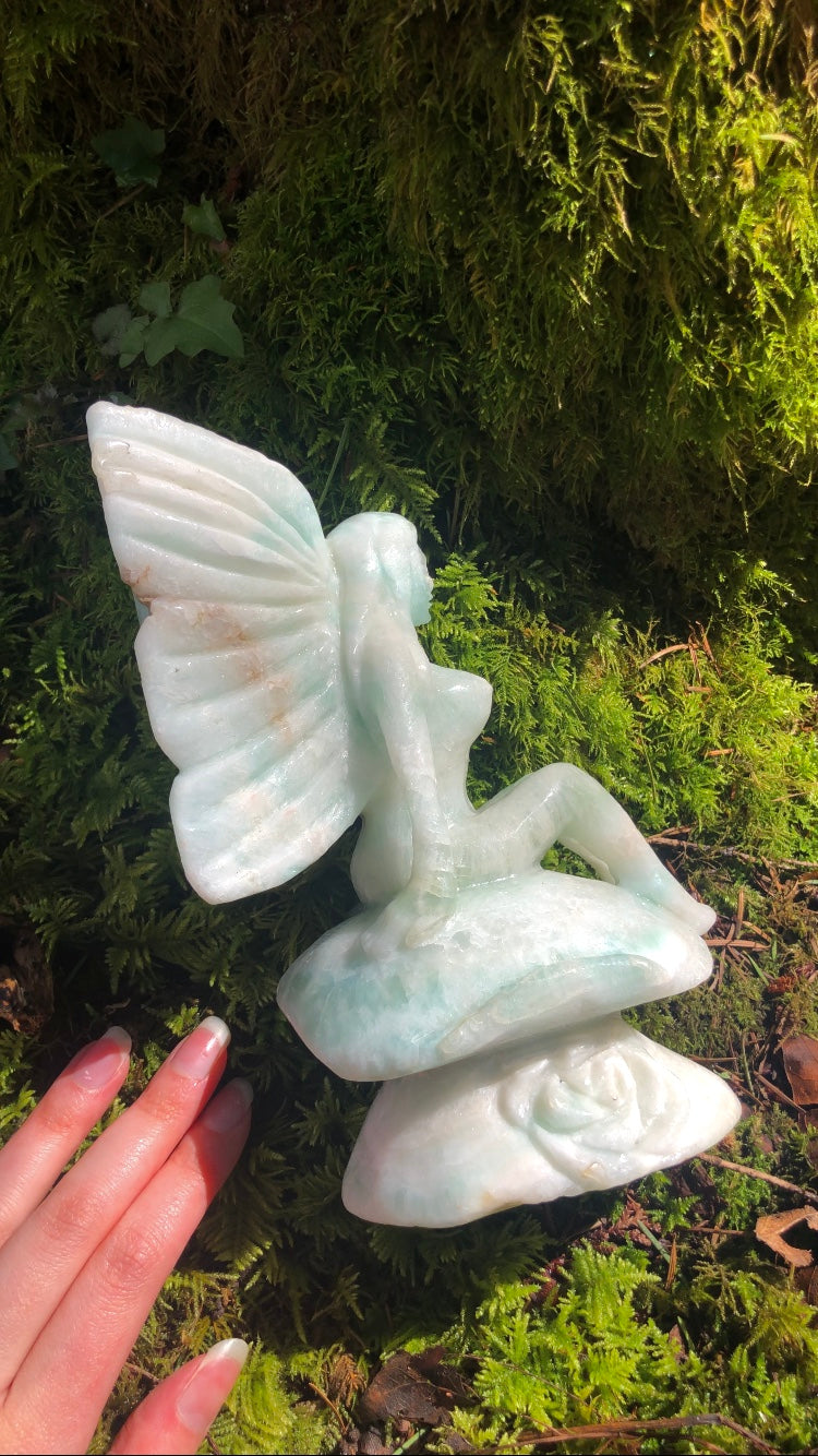 RAFFLE ~ XL Caribbean Calcite fairy sitting on top of a large mushroom with roses!
