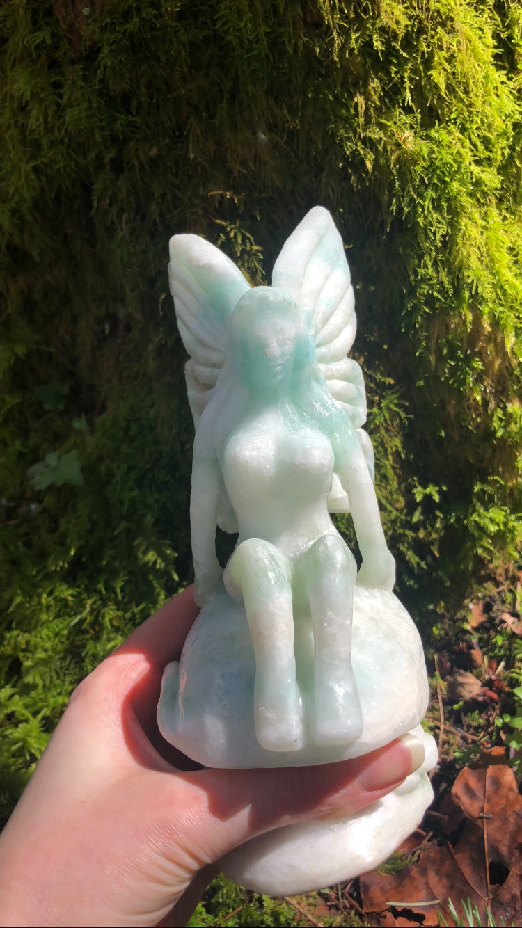 RAFFLE ~ XL Caribbean Calcite fairy sitting on top of a large mushroom with roses!